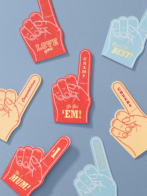 studio lifestyle image of die cut foam finger hot foiled greeting cards 