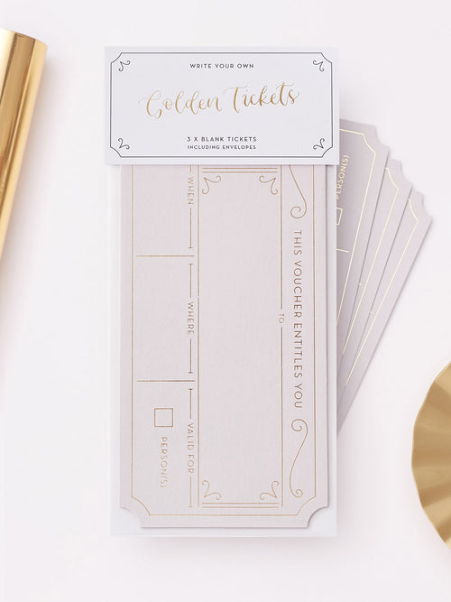 A set of 3 Plume Grey hot foiled golden tickets. With matching grey envelopes, displayed on a clean white background with decorative gold paper props.