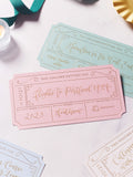 selection of gift vouchers with gold foil on a marble tabletop, personalised with modern calligraphy to create bespoke golden tickets