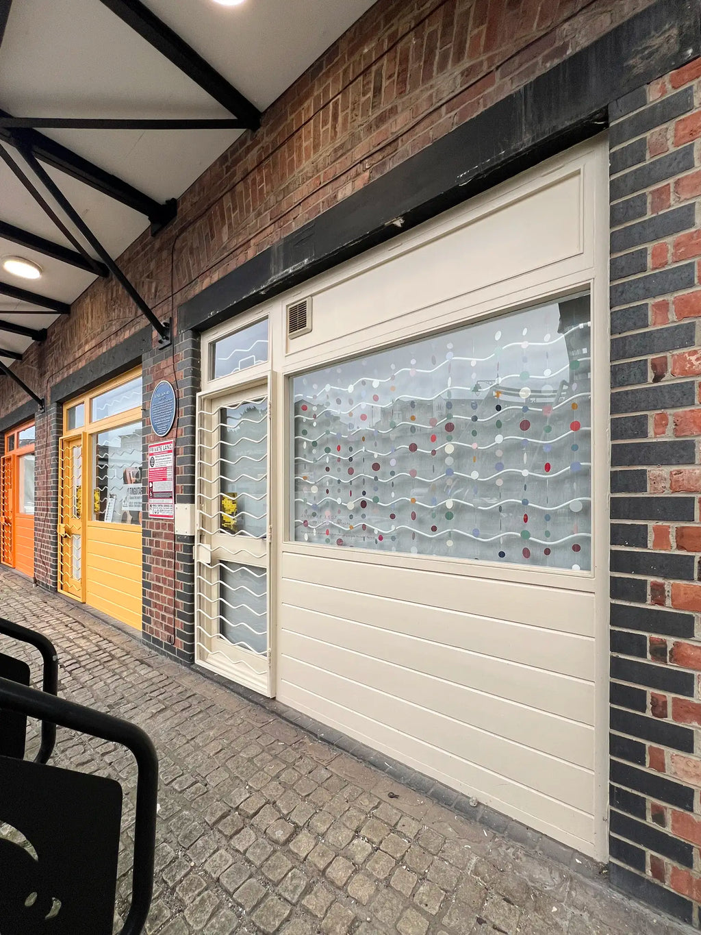 shopfront in north shields with paper decorations in the window, hosting a beginners modern calligraphy workshop